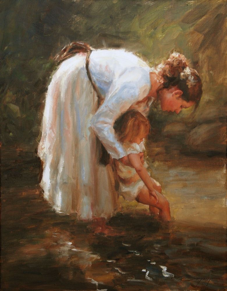 woman beautiful woman in dress holding her daughter in a stream