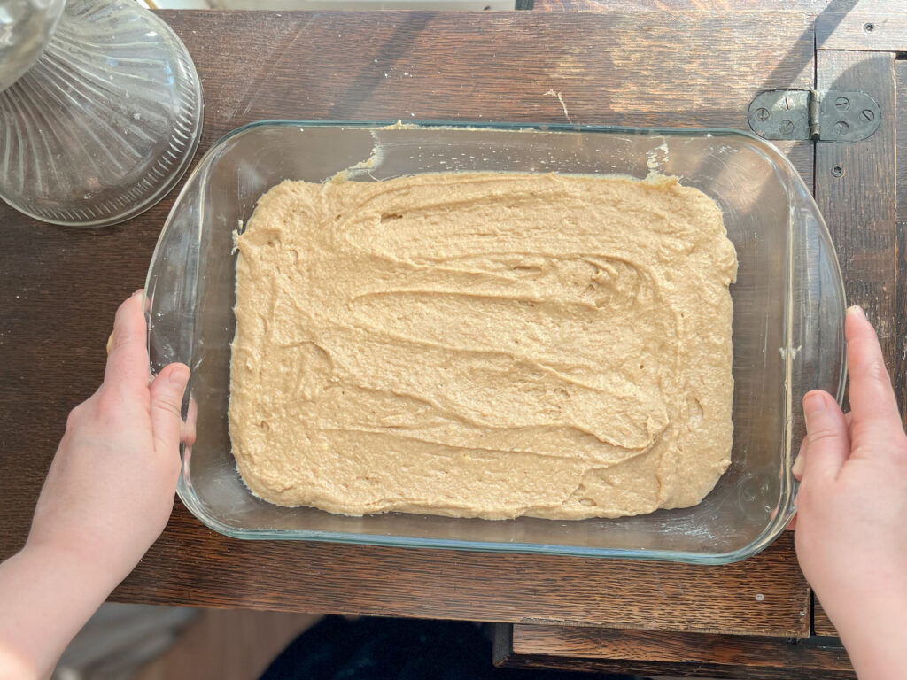 glass 9x13 pan with einkorn applesauce cake batter