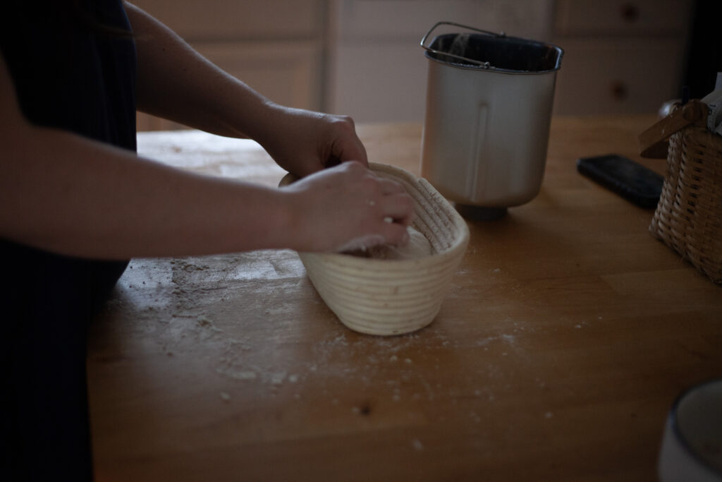 a woman making sourdough bread 