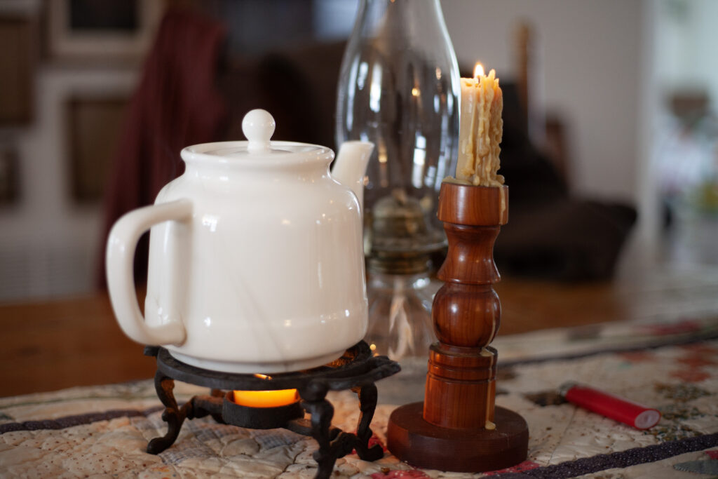 beeswax candles and a pot of tea